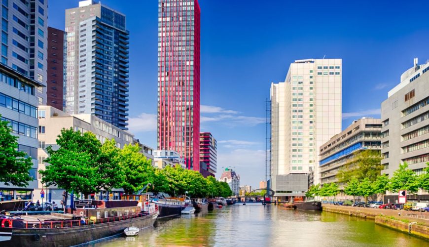 Canal running through modern skyline of Rotterdam